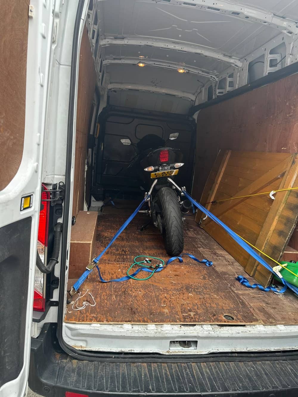 PowerMove Removals van with motorcycle securely strapped inside
